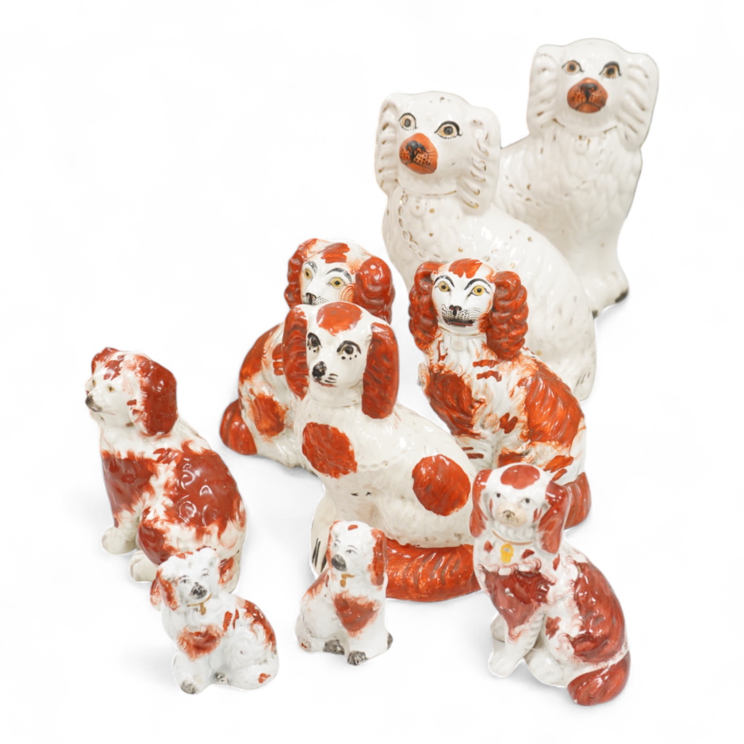 Nine different sized 19th century Staffordshire chimney dogs, tallest 23cm
